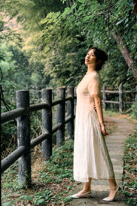 Young woman standing on field