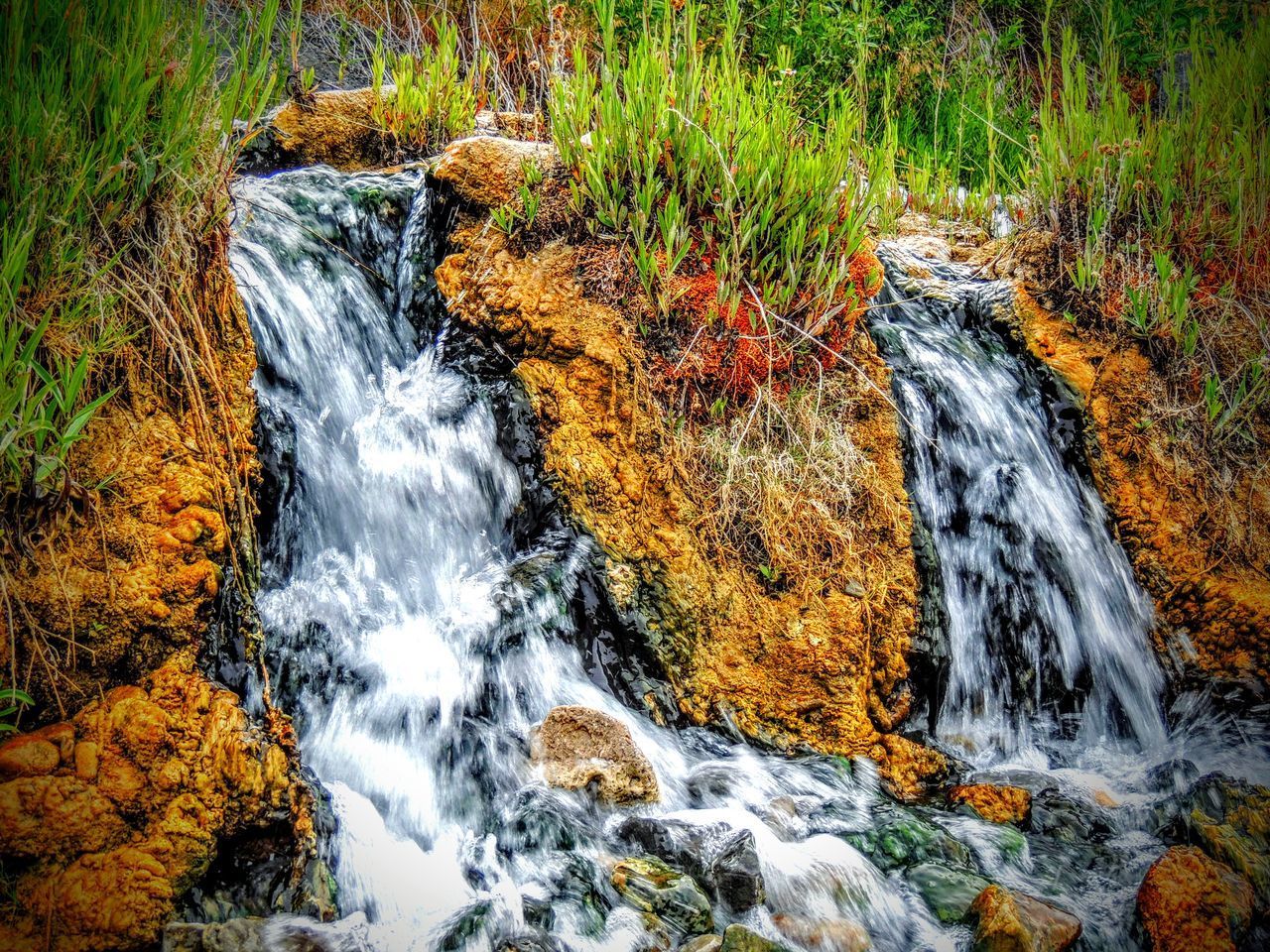 STREAM FLOWING THROUGH ROCKS