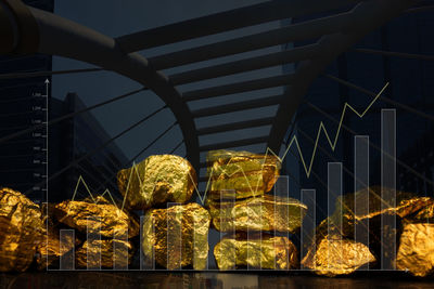 Low angle view of illuminated lanterns on railing