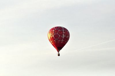 Low angle view of hot air balloons against sky