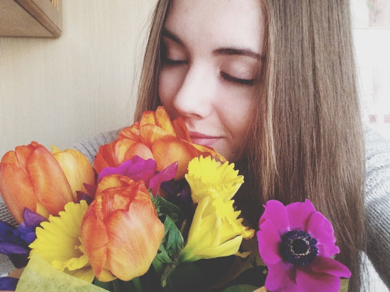 flower, indoors, petal, person, fragility, freshness, holding, flower head, lifestyles, leisure activity, close-up, part of, home interior, high angle view, cropped, bouquet