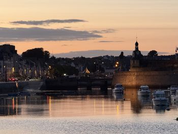 Scenic view of river against sky during sunset