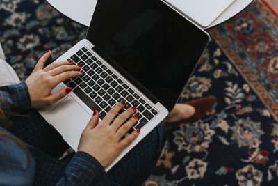 Woman's hands on laptop keyboard