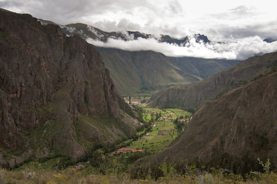 Scenic view of andes mountains against cloudy sky