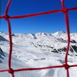 Scenic view of snowcapped mountains against clear sky