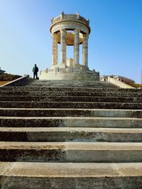 Low angle view of man standing on steps