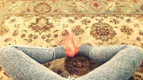 Low section of woman sitting on floor