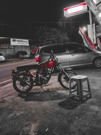 Bicycles parked on road at night