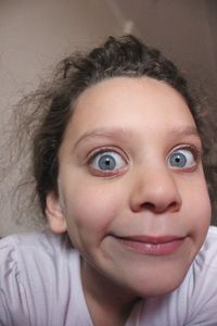 Close-up portrait of girl at home