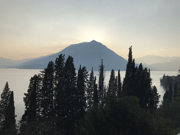 Scenic view of mountains against sky during sunset at lake como