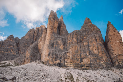 Rock formations on mountain against sky