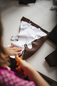 Girl cutting material