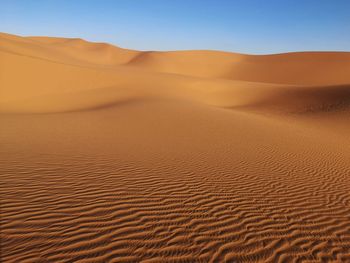 Scenic view of desert against clear sky