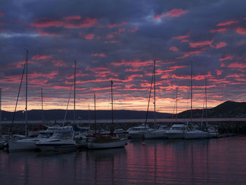 Sailboat in sea at sunset