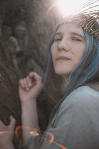 Close up ancient celtic styled woman looking down in bright sunlight portrait picture