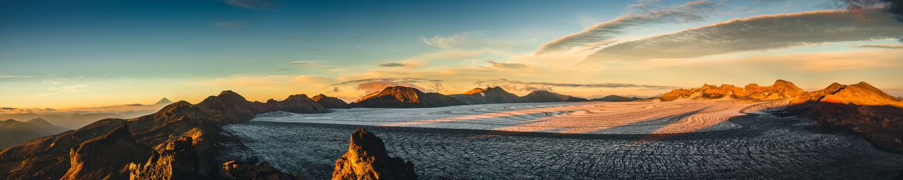 Panoramic view of mountains against sky during sunset