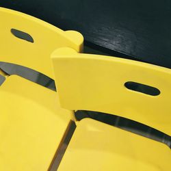 High angle view of yellow chair on table