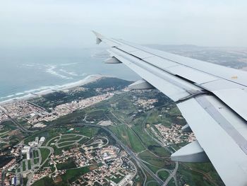 Aerial view of airplane flying over landscape