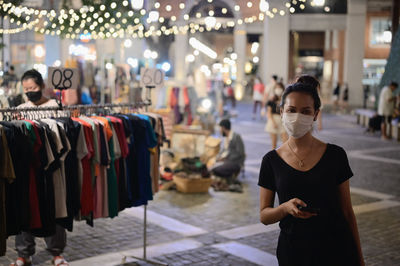 Series photo of young women shopping in night street market , chiang mai north of thailand