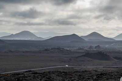 Scenic view of landscape and mountains against sky