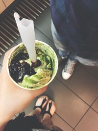 Midsection of woman holding ice cream