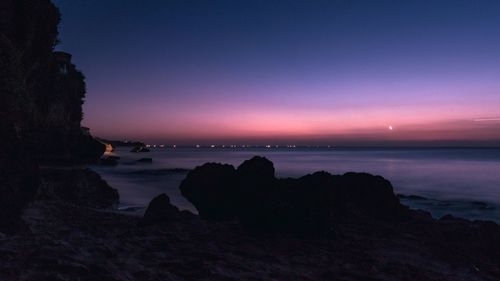Scenic view of sea against sky at sunset