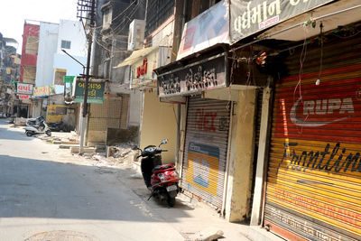 People on street amidst buildings in city