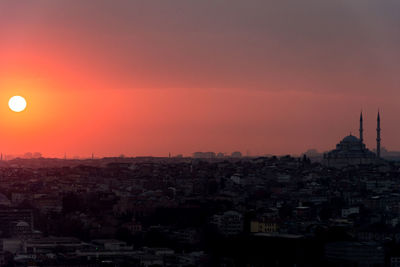 Cityscape against sky during sunset