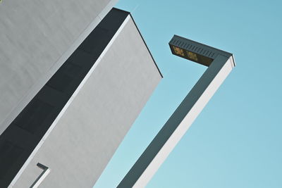 Low angle view of building against clear blue sky