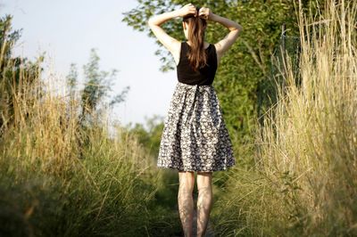 Woman standing on grass