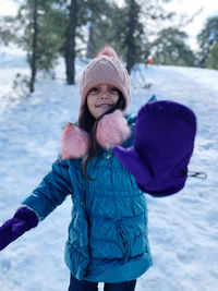 Portrait of smiling girl in snow