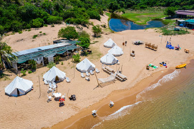 High angle view of people relaxing on beach