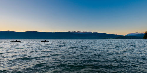 Scenic view of sea against clear sky during sunset