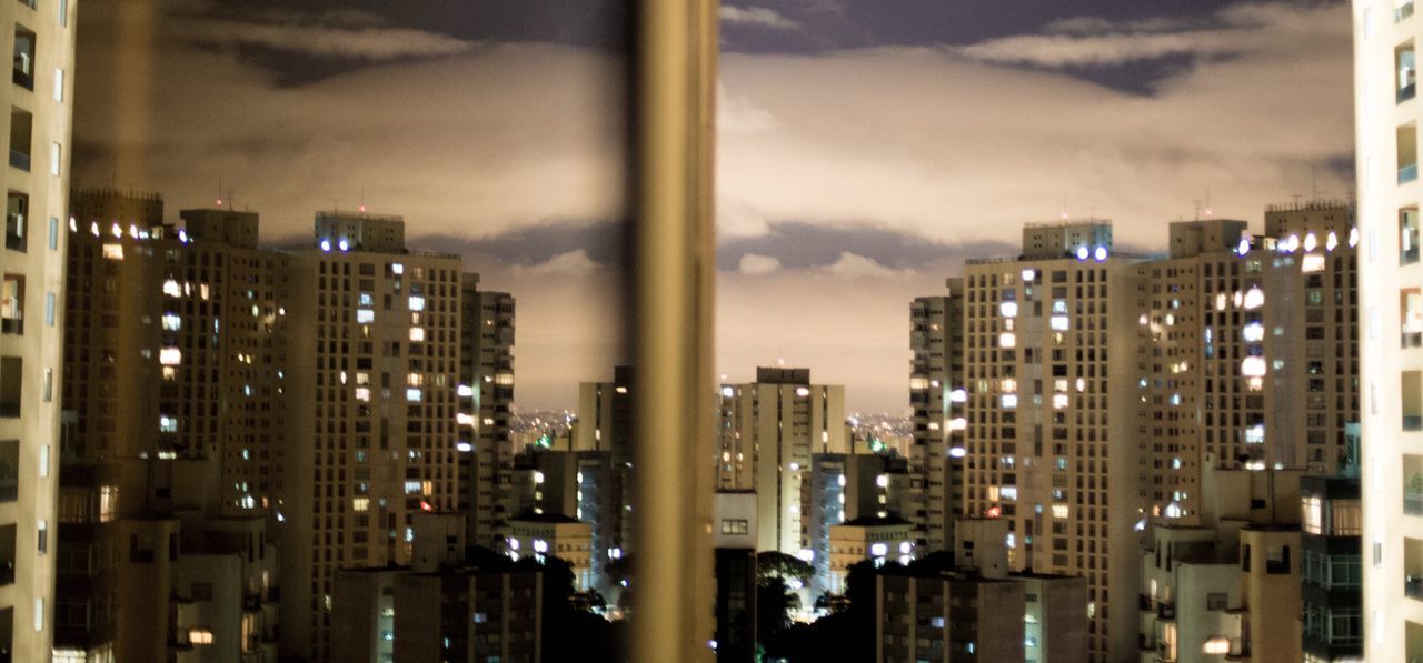 BUILDINGS IN CITY AT NIGHT