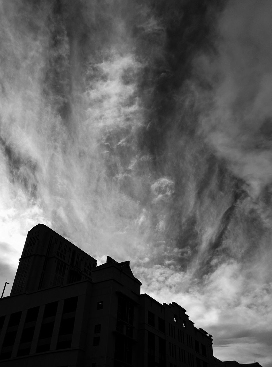 LOW ANGLE VIEW OF BUILDINGS AGAINST CLOUDY SKY