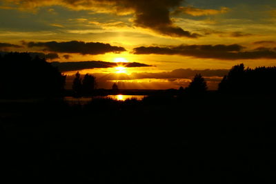 Scenic view of silhouette against sky during sunset