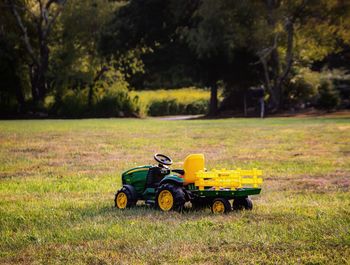 Motor scooter parked on field