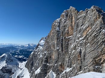 Scenic view of snowcapped mountains against clear sky