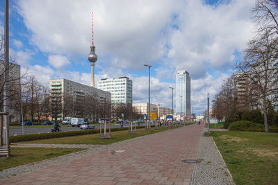 Street amidst buildings against sky