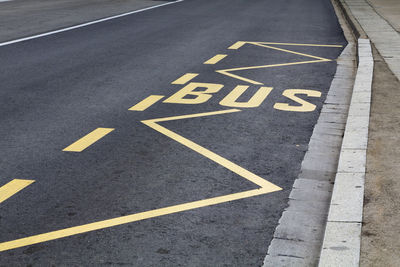 High angle view of arrow sign on road