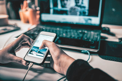 Close-up of man using mobile phone