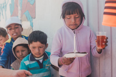 Close-up of boy holding food