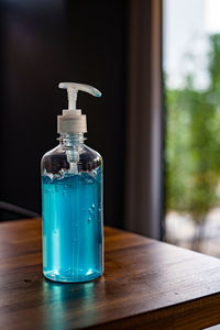 Close-up of glass bottle on table