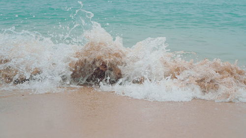 Waves splashing on shore