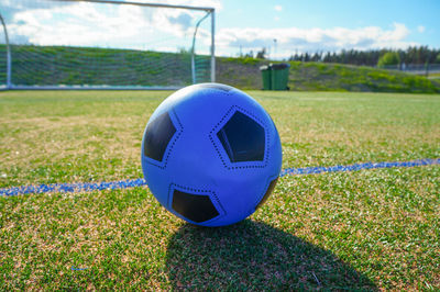 Close-up of soccer ball on field