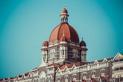 Low angle view of building against clear blue sky