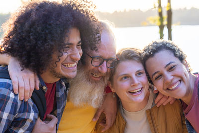 Portrait of smiling friends at beach