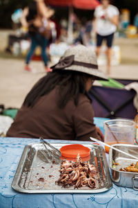 Man preparing food at market stall
