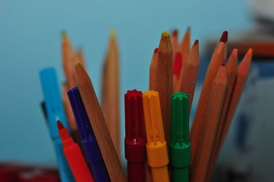 Close-up of sketch pens and colored pencils