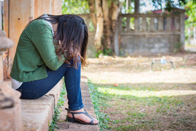 Woman sitting in park